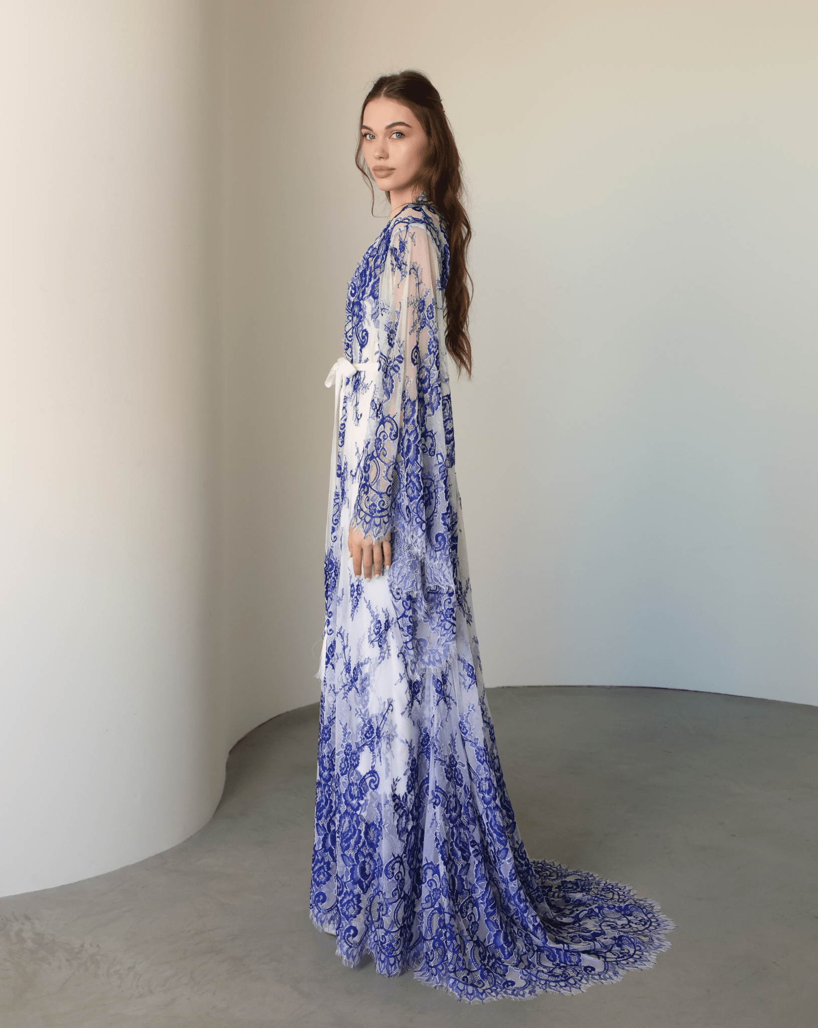 Side perspective of the Robe and Nightgown Set, showcasing the full length of the lace robe and its light layers.