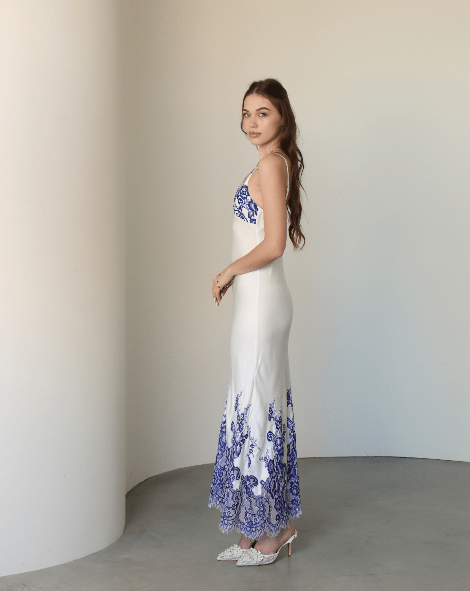 Side view of the sleeveless nightgown, highlighting the soft natural fabric and its clean, simple lines.