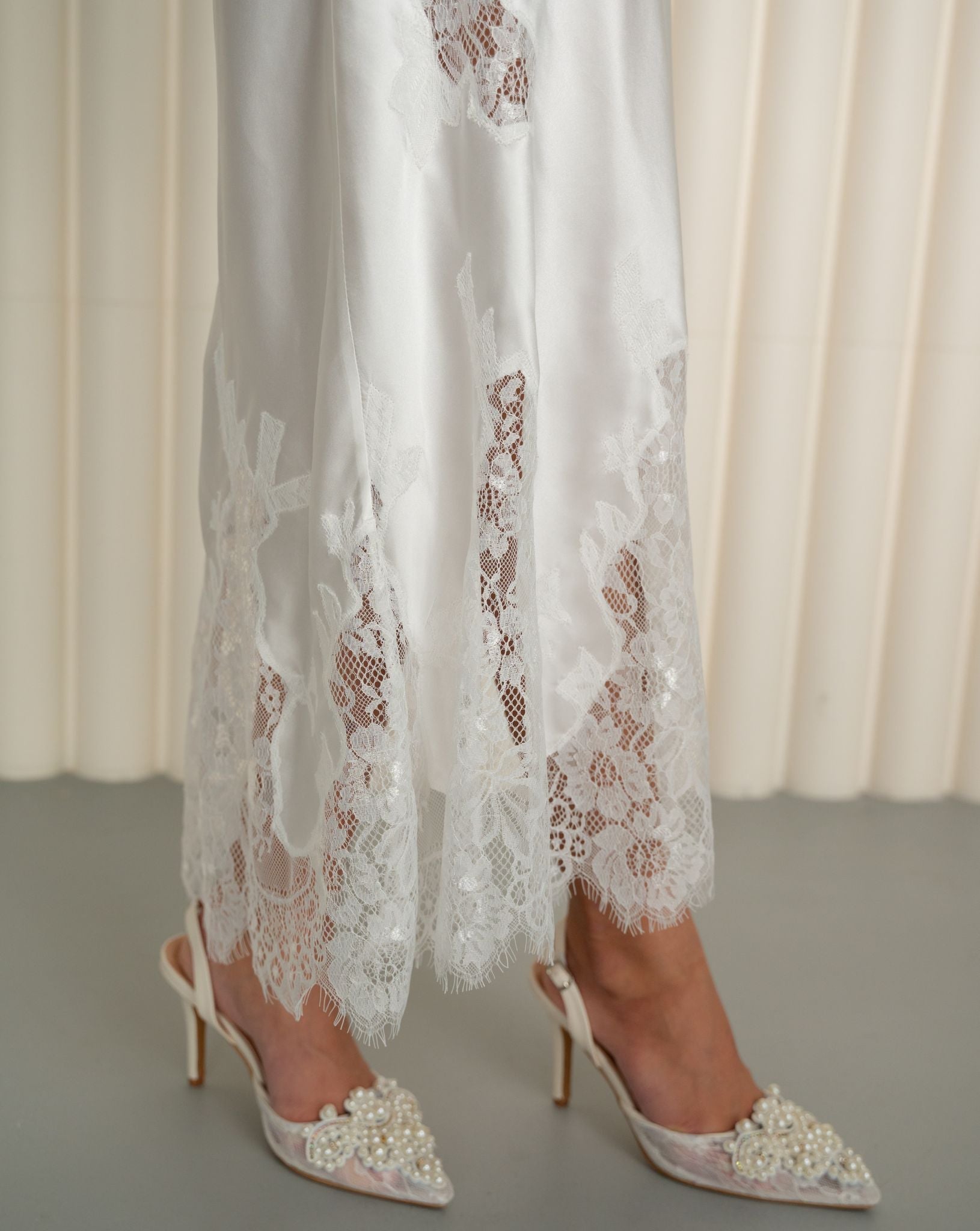 Detailed view of lace embroidery on silk nightgown by Kafemme