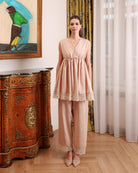 Front view of the pajama trousers and top, featuring soft elastic under the bust and delicate lace embellishments.