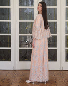 A side perspective of the ensemble, showing how the matching pants fall smoothly along the leg for ease of movement.