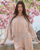 A mid-length shot of the Pajama Pants and Top, showcasing the V-shaped neckline and graceful movement of the top.