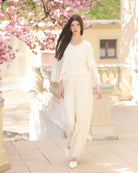 A dynamic motion shot of the Pajama Pants and Top, capturing the effortless silhouette and layered lace details.
