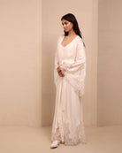 A dynamic shot of the white Robe and Nightgown Set in motion, balancing functionality with romantic beauty.