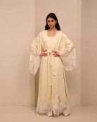 A poised shot of the tied nightgown, showcasing the flattering fit that adapts as the body changes.