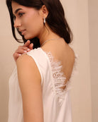 A close-up side shot of the white nightgown, focusing on the soft, breathable fabric and feminine silhouette.