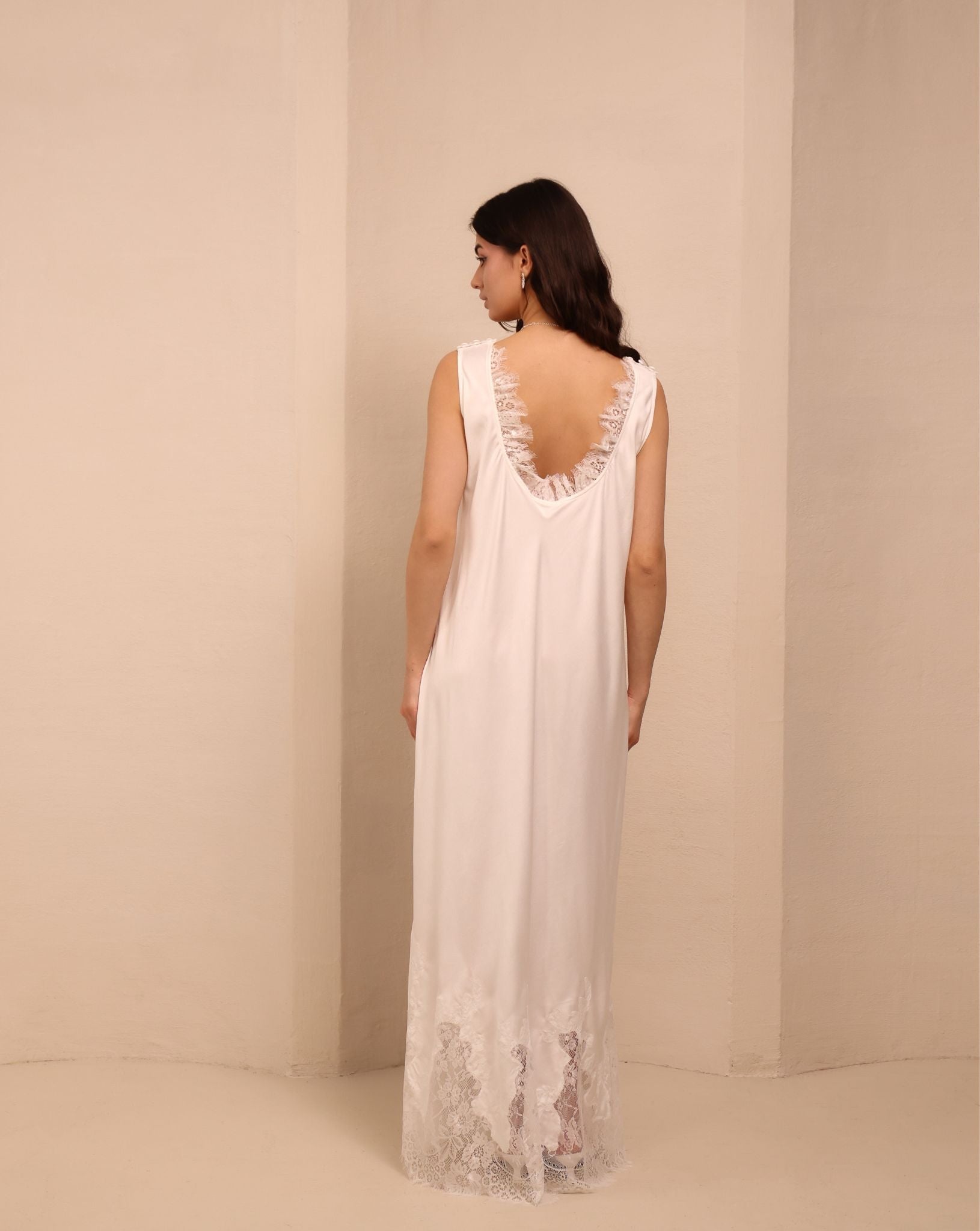 A final rear view of the white nightdress, highlighting the clean look and natural softness of the material.