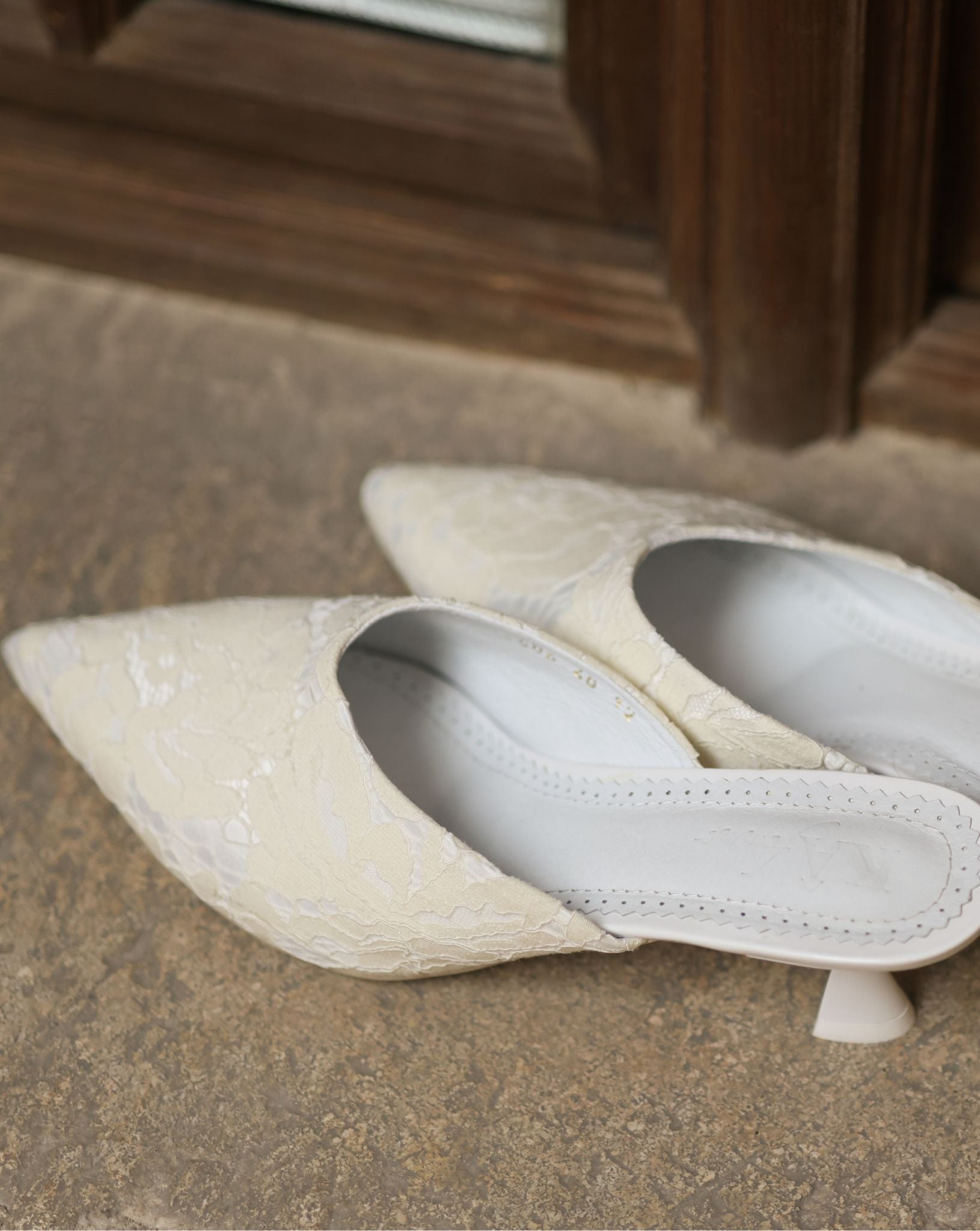 A static top view of the Satin Slippers, showcasing the soft padded insole made of genuine leather.