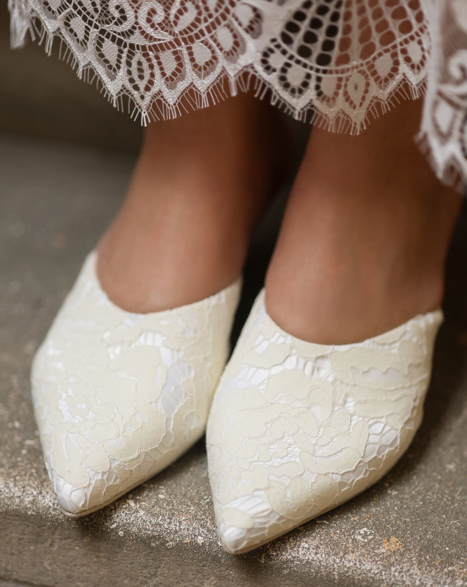 A high-angle shot of the footwear on feet, illustrating how the satin base follows the foot's form.