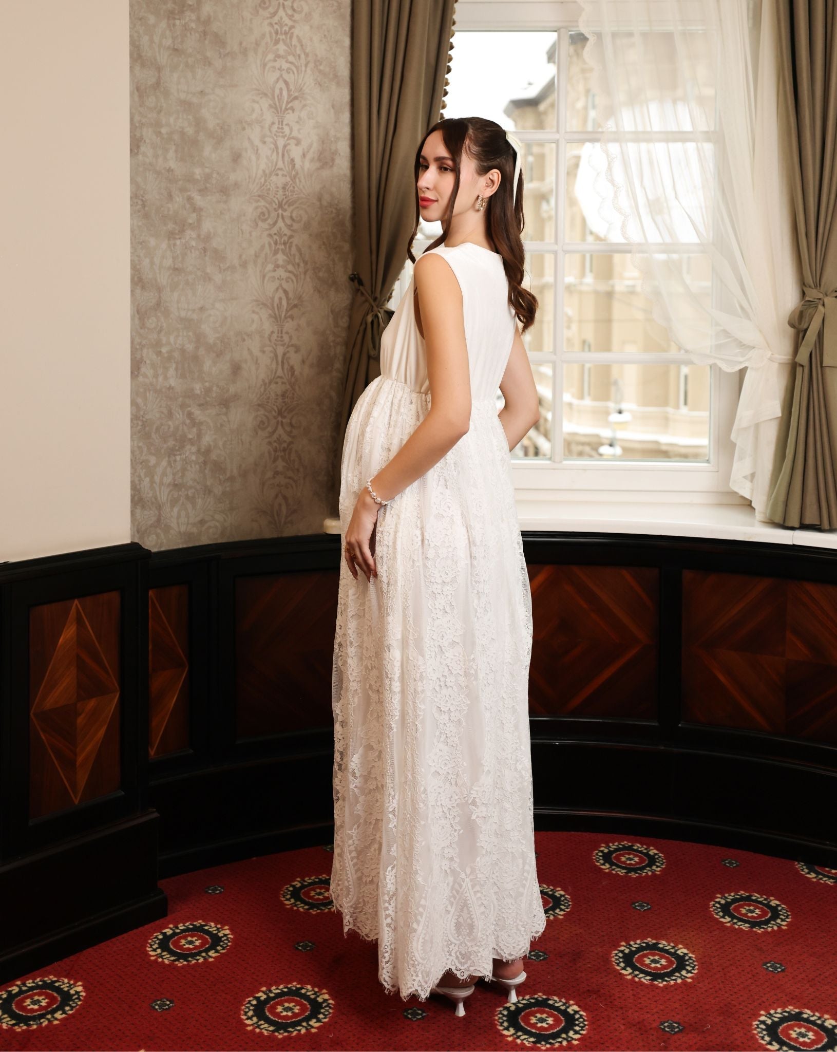 Side perspective of the velvet and lace gown, illustrating how the breathable fabric gently flatters the figure.