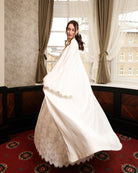 An action shot of the flowing velvet robe, illustrating the ease and soft drama of the premium fabric.