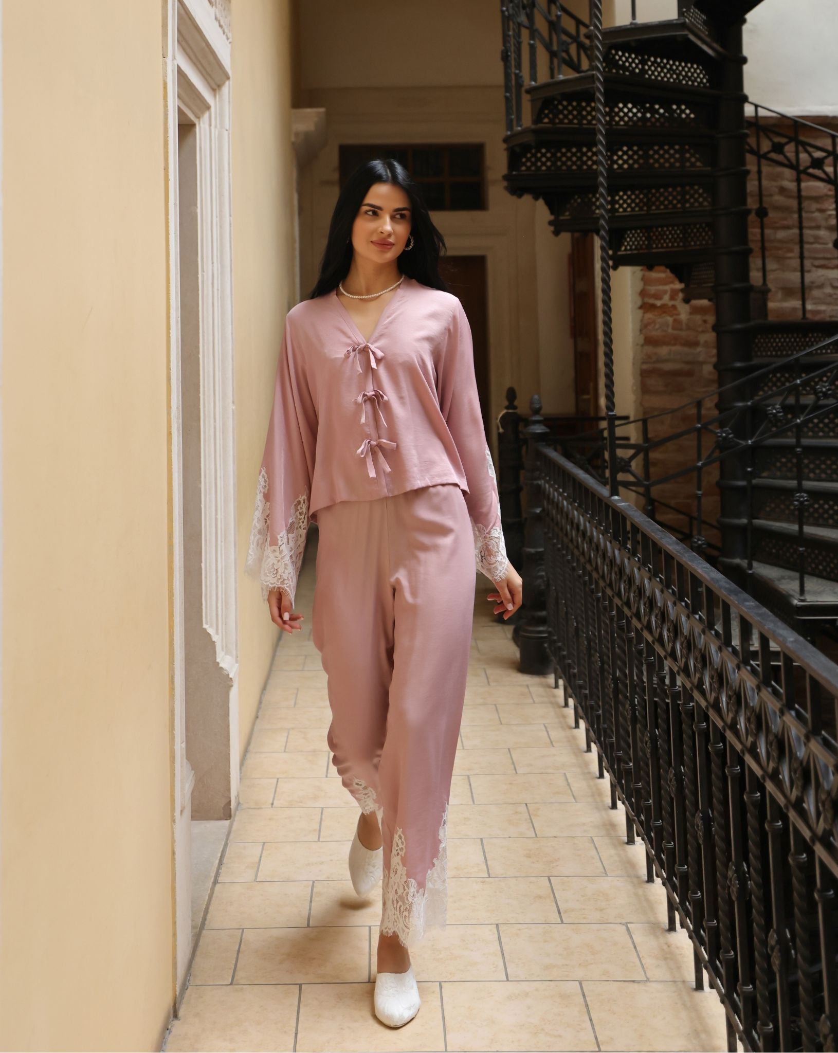 A full-length motion shot of the attire, illustrating the effortless fall of the pants and breathable comfort.