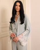 Close-up from head to hips, showcasing the delicate button closure on the tank top for an adjustable fit.