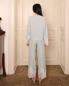 Rear perspective of the pajama set, illustrating the smooth feel of the fabric and the effortless, flowing fit.