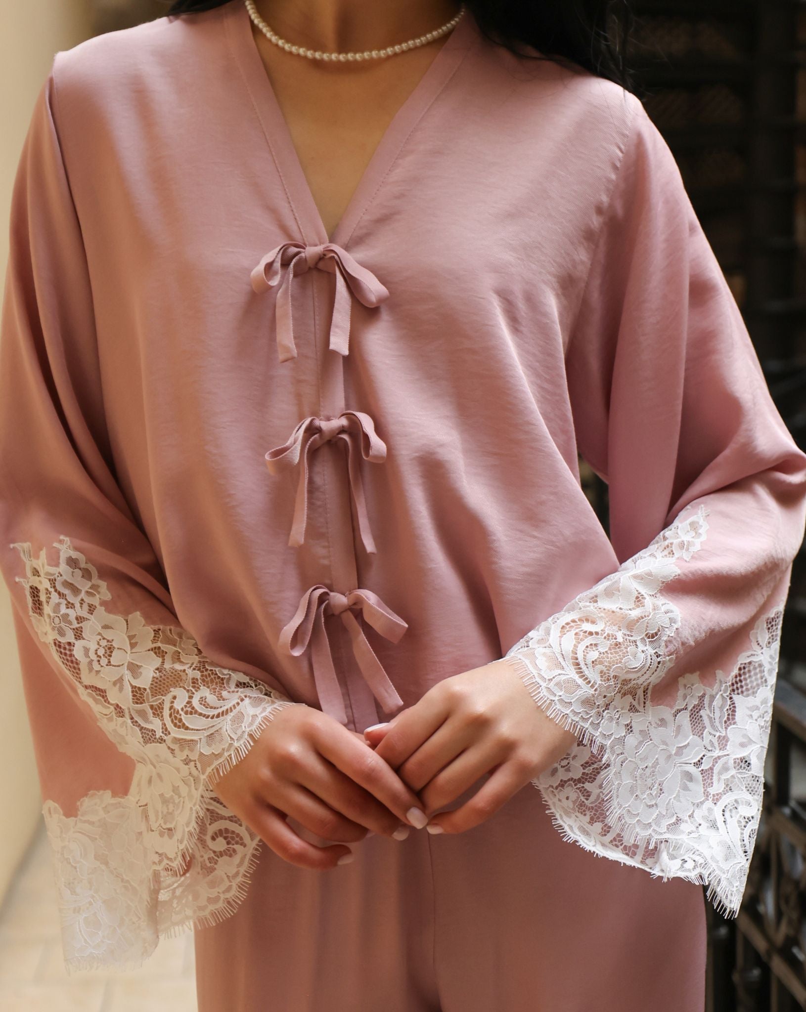 A close-up of the Pajama Pants and Top's upper part, focusing on the delicate bows and lace-detailed sleeves.
