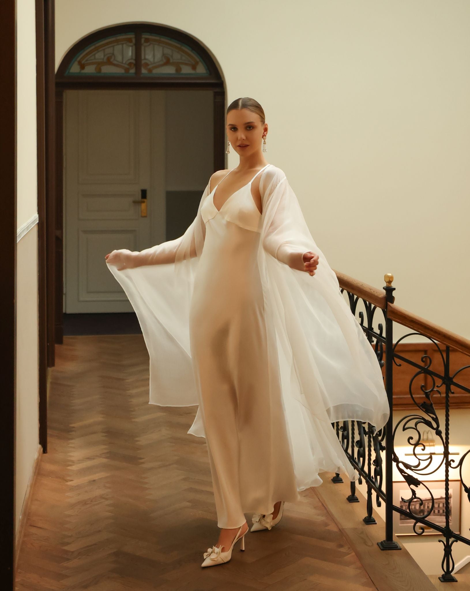 Close-up of the exceptionally long and flowing sleeves of the bridal silk wrap, made from 100% mulberry silk.