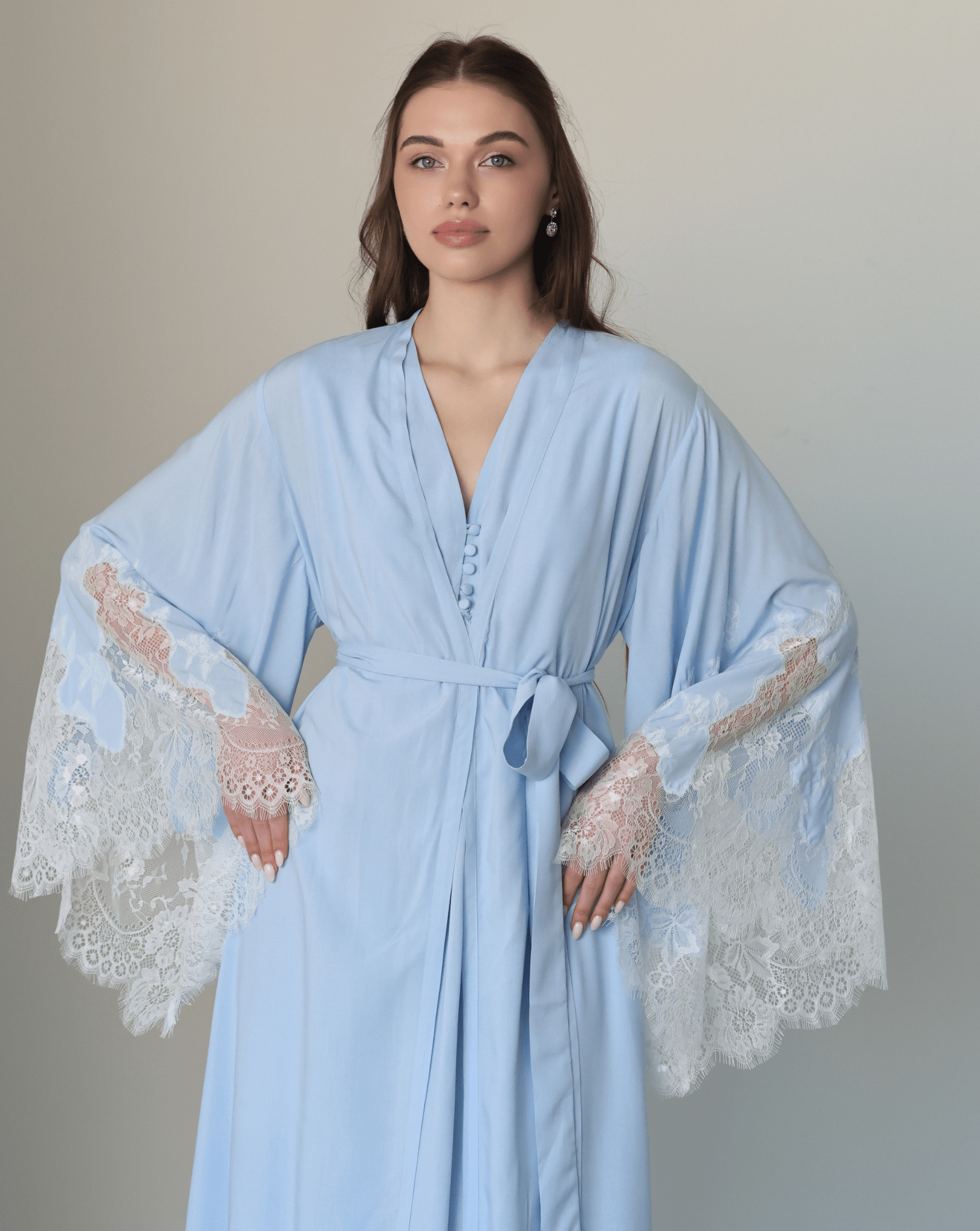 Mid-length shot of the attire, highlighting the wide sleeves with delicate lace ends and a well-put-together look.