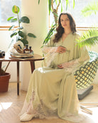 A serene seated view of the set, focusing on the breathable fabric and the relaxed fit for daily wear at home.