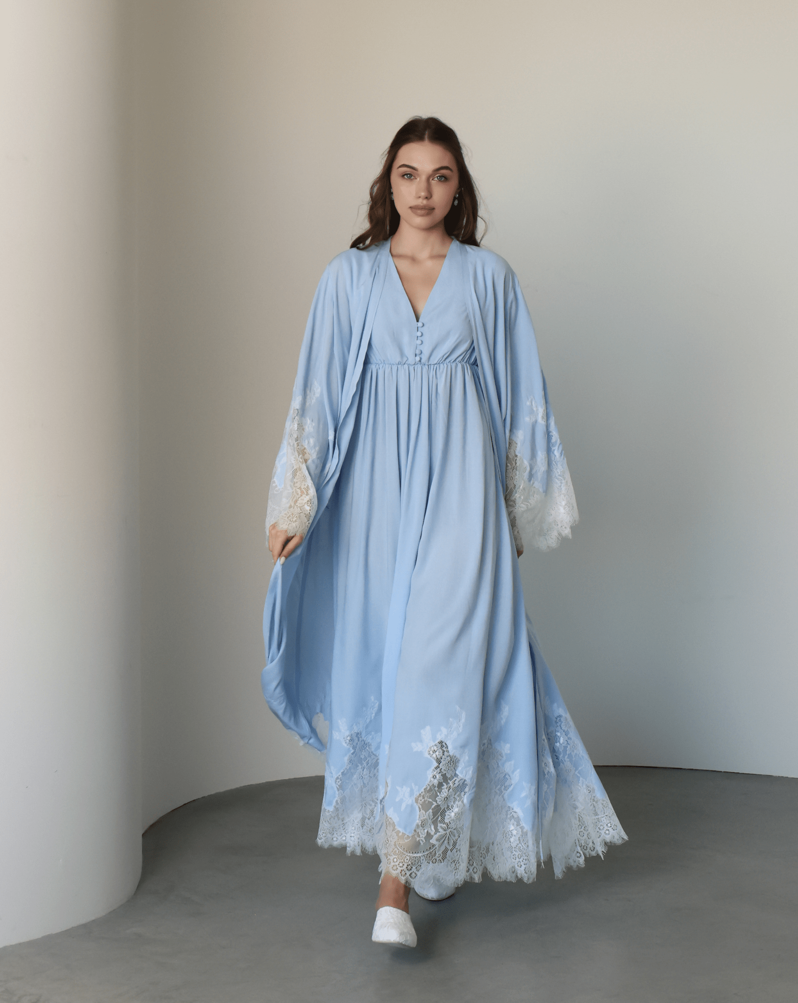 A full-length motion shot of the Robe and Nightgown Set, capturing the breathable cotton blend and graceful movement.