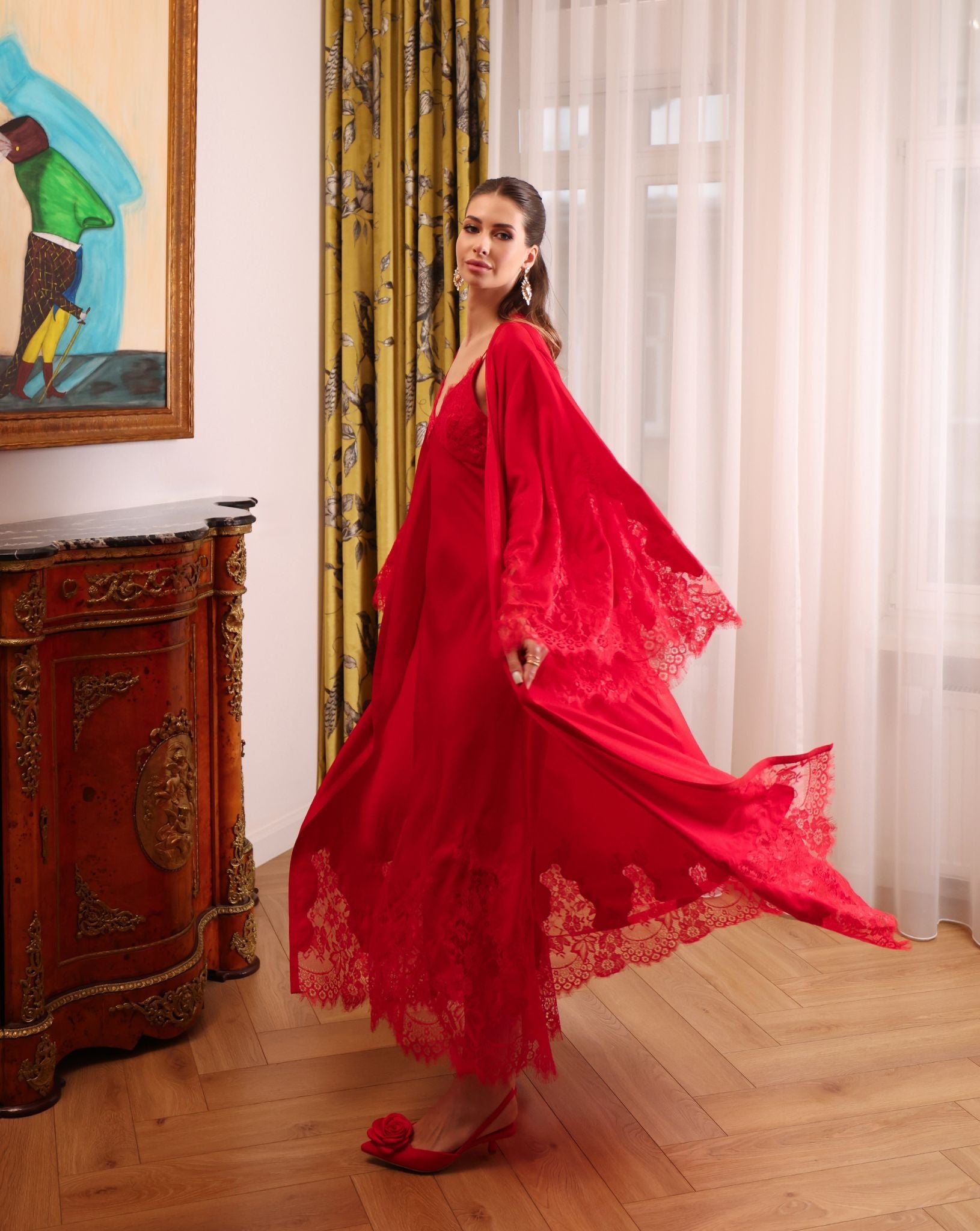 Action shot of the flowing robe, capturing the light and cool feel of the fabric during a dramatic movement.