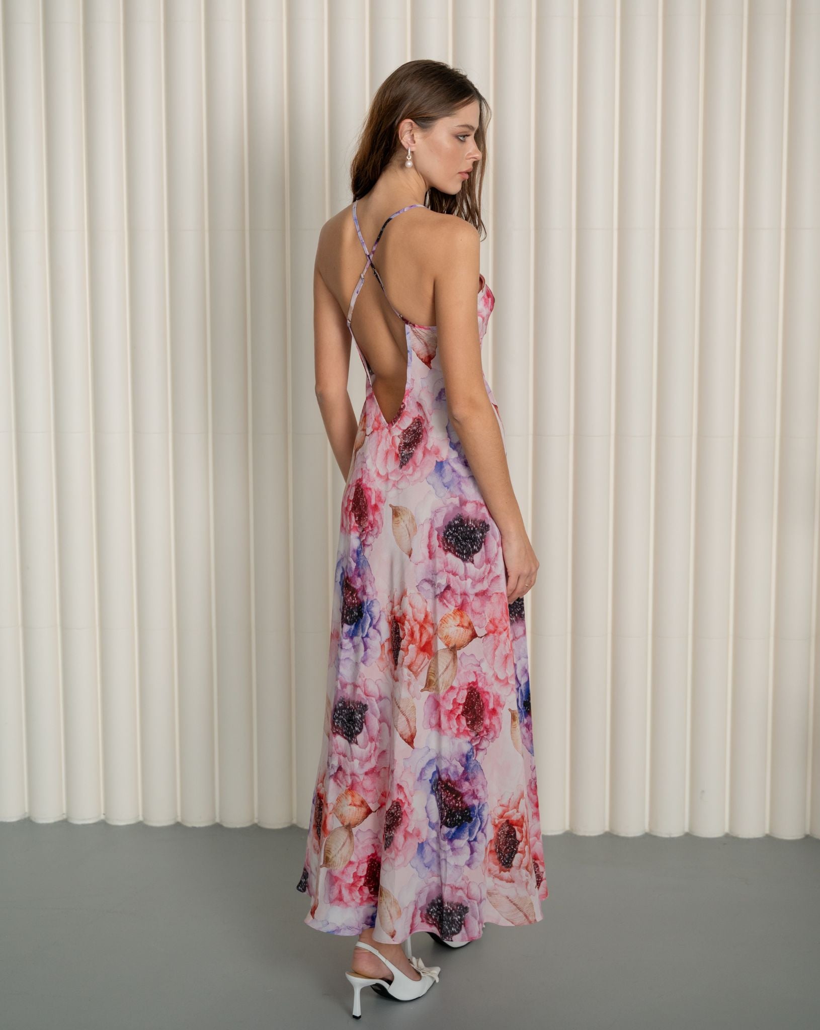 Rear view of a silk nightgown featuring crisscross back straps and a sophisticated mid-open V-cut design.