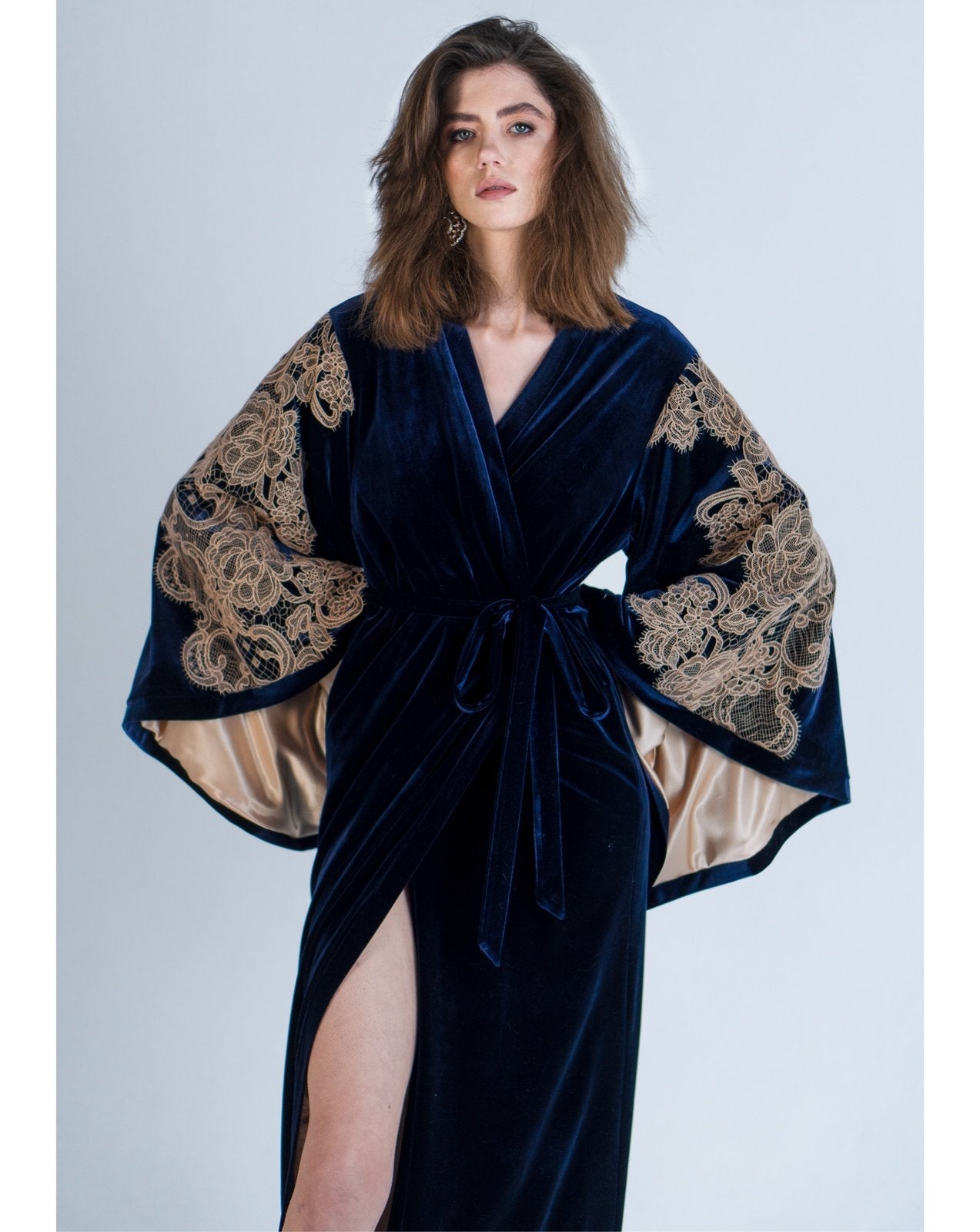 Model wearing navy velvet kimono robe with wide lace sleeves by Kafemme